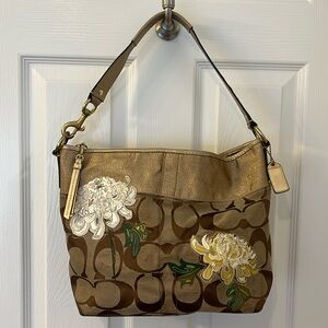 Coach canvas bag in beige and brown with gold accents,hardware and leather strap